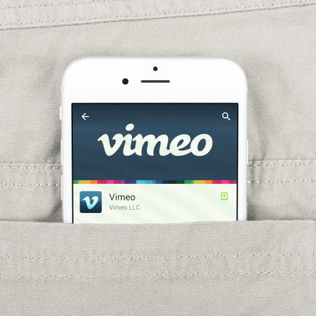 Simferopol, Russia - April 18, 2015: Black Apple iPhone 6 in the pocket displaying Vimeo...