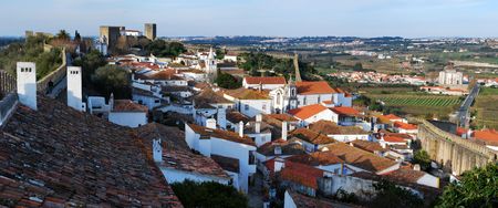The town of Obidos is located on a hill and is still encircled by a fortified wall, Portugal.の写真素材