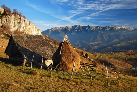 Autumn landscape in Magura village, with Bucegi mountains in background, Romaniaの写真素材