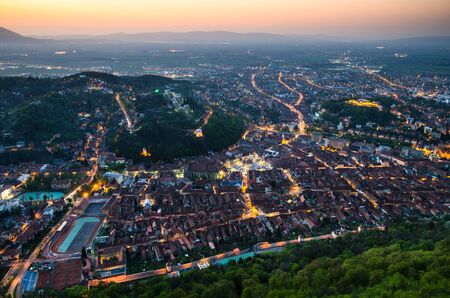 Brasov city at dusk, Romania main touristic town の写真素材