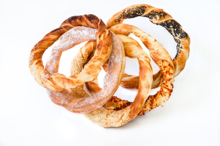 Pack of different pretzels  romanian pastry  with salt, cheese, sesame and poppyの写真素材