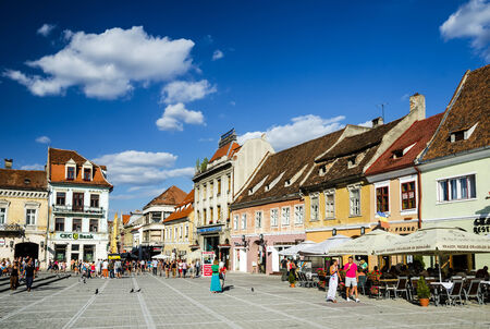 BRASOV, ROMANIA - 2 AUGUST: Image with tourists in Brasov, taken on 2nd August 2013. Council Square is medieval center of Brasov city in Transylvania.のeditorial素材
