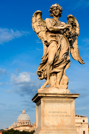 Angel with thorn crown, statue of Raffaello on Ponte Sant'Angelo in Rome, Italy.の写真素材