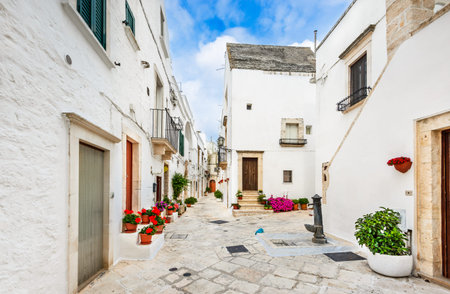 Locorotondo, Italy. Medieval whitewashed street and houses in small city of Puglia, Apulia, Bari region.のeditorial素材