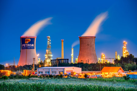 BRAZI, ROMANIA - 24 JULY 2015: Twilight image of Brazi Rafinery, OMV Petrom petrochemical oil...