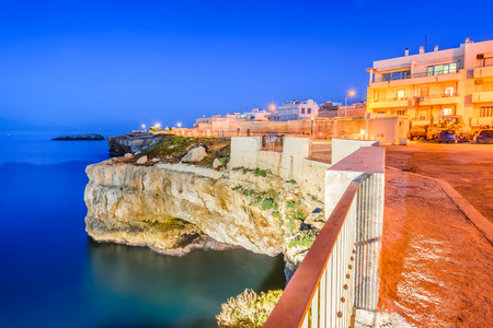Puglia, Italy. Sunset scenery of Polignano a Mare, town in the province of Bari, Apulia, southern Italia on the Adriatic Seaの写真素材