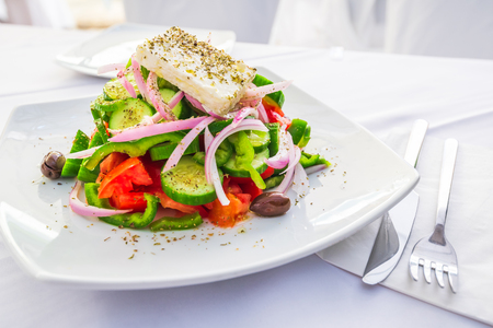 Greek salad with fresh vegetables, feta cheese and olives, Greece traditional cuisine.の写真素材