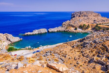 Rhodes, Greece. Lindos small whitewashed village and the Acropolis, scenery of Rhodos Island at Aegean Sea.の写真素材