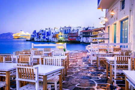 Mykonos, Greece. Colored sunrise of Litrtle Venice of Cyclades Islands on Aegean Sea.の写真素材