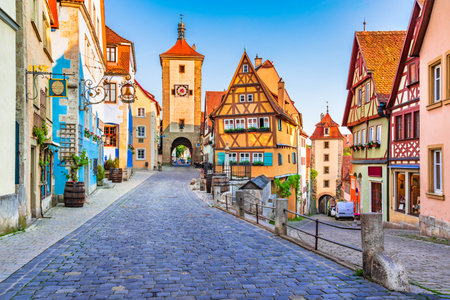Rothenburg ob der Tauber, Bavaria, Germany. Beautiful sunset postcard view of Ploenlein square in Rothenburg, famous historic town in Franconia.のeditorial素材