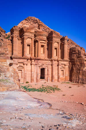 Petra, Jordan. Highlight of Petra, the amazing Ad Deir, Monastery with blue sky.の写真素材