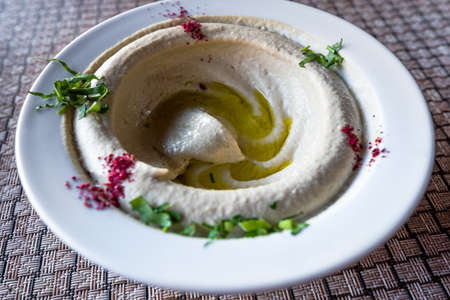 Hummus, Humus on a dish, traditional starter in Middle East. Wadi Musa, Petra in Jordan, jordanian local cuisine.の写真素材