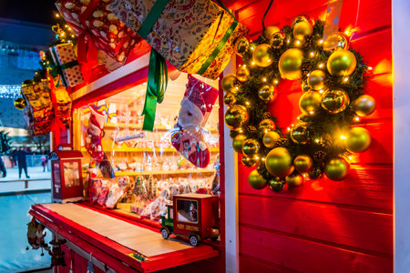 Craiova, Romania. Famous Christmas Market, european top 2022 winter destination in Eastern Europe, historical Oltenia. Wooden kiosk with Xmas decorations.のeditorial素材