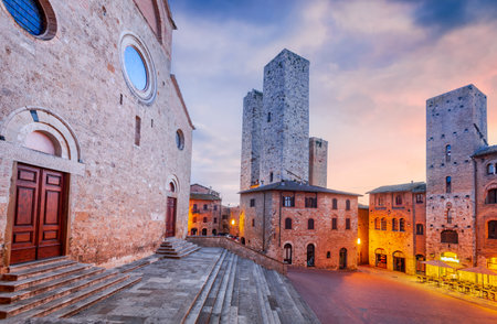 San Gimignano, Tuscany. Picturesque View of famous Piazza del Duomo with Torri Ardinghelli, Torre Chigi and Torre Rognosa. Typical tuscan hill town in Italy.の写真素材
