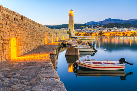Rethymno, Greece. Idyllic city at Crete, Greek Islands. Morning view of the old venetian harbor and Venetian Fortezza Castle.の写真素材