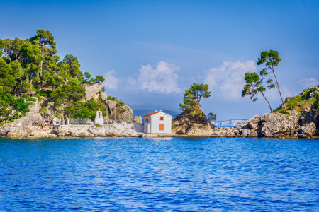 Parga, Greece. Panagia Chapel and turquoise waters of Ionian Sea, Epirus coastline, Greek travel landscape.の写真素材