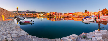 Rethymno, Greece. Panoramic view of Venetian Harbor and old lighthouse, city at Crete, Greek Islands.の写真素材