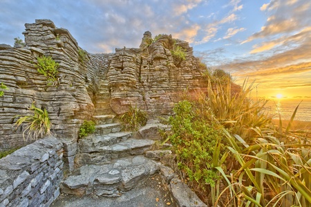 Pancake Rocks in warm sunset light, South Island, New Zealandの写真素材