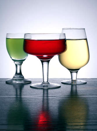 three glass in different colorsの写真素材