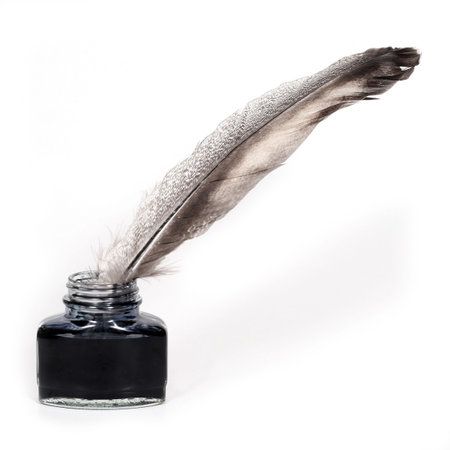 feather quill and inkwell over white backgroundの写真素材