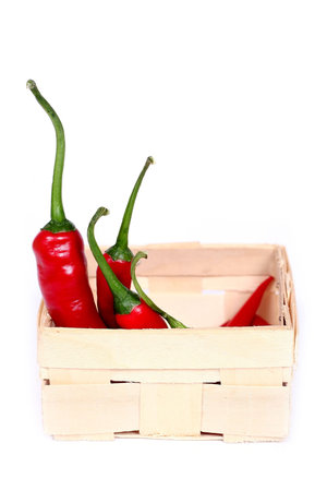 hot chilli peppers in a basketの写真素材