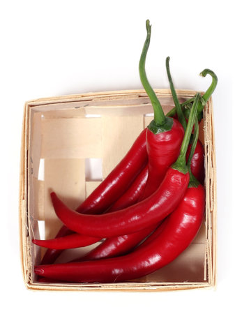 hot chilli peppers in a basketの写真素材