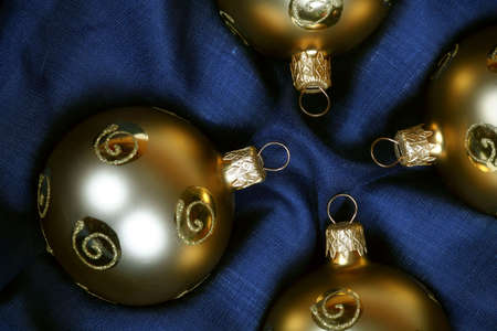 gold christmas balls in blue boxの写真素材