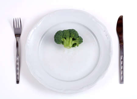 Fresh broccoli on a white plateの写真素材