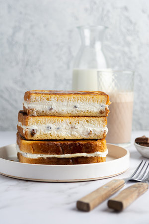 Sweet Cream-Filled Toast Stack with Milkの写真素材