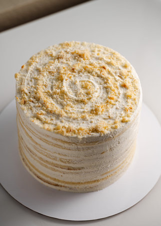 German recipe Milch madchen (Milky girl) cake with whipped cream frosting. Top view angle.