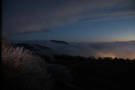 Mountains and Hills panoramic view of the landscape. villages and foggy area. evening view.の写真素材
