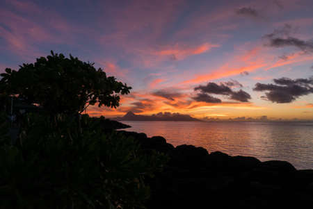 Colored sunset on an islandの写真素材