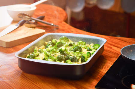 Baked broccoli and pasta with melted cheeseの写真素材