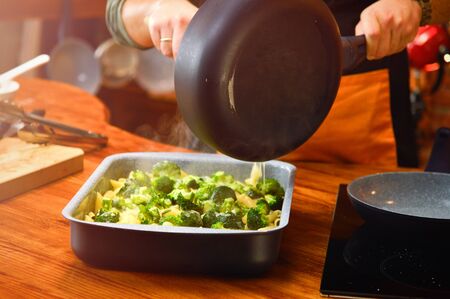 Baked broccoli and pasta with melted cheeseの写真素材