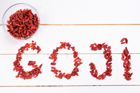 Goji berries on wooden tableの写真素材