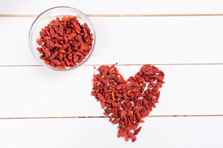 Goji berries on wooden tableの写真素材