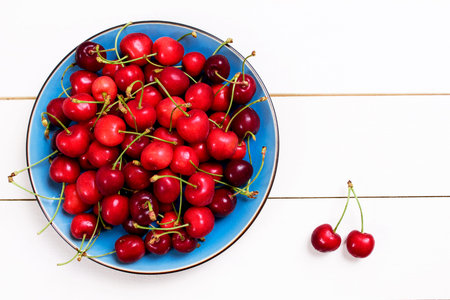 Fresh cherries on wooden table
