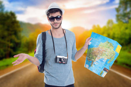 Lost tourist looking at city map on a trip. Looking for directions.の写真素材