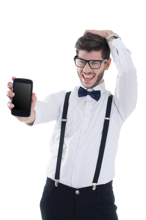 Young man showing a mobile phone application isolated on a white backgroundの写真素材
