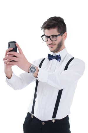 Young man making sad selfie, isolated on white backgroundの写真素材
