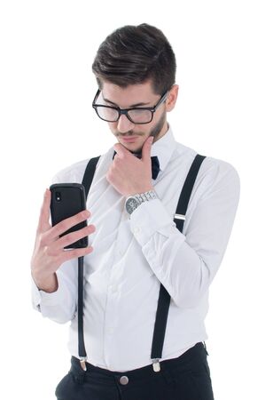 Upset stressed man holding cell phone and reading massageの写真素材