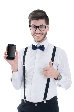 Young man showing a blank smart phone screen with thumbs up isolated on a white backgroundの写真素材