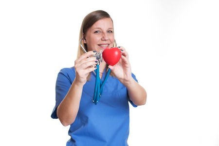Woman doctor holding a red heartの写真素材