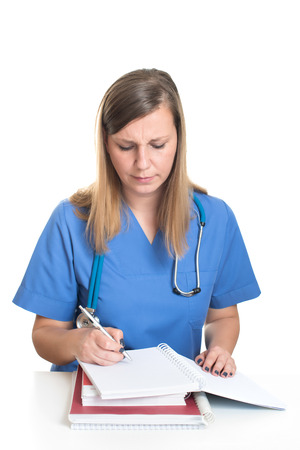Female doctor studying hard booksの写真素材