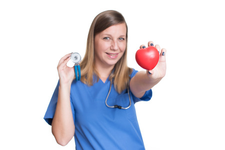 Woman doctor holding a red heartの写真素材