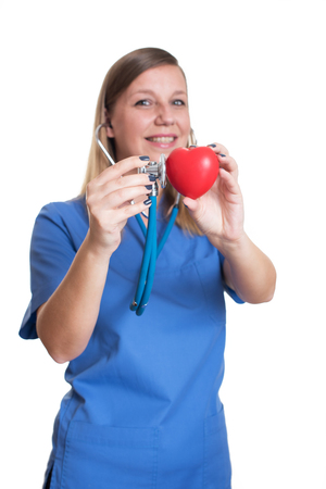 Woman doctor holding a red heartの写真素材