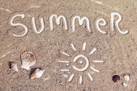 "summer" handwritten on sand, summer backgroundの写真素材