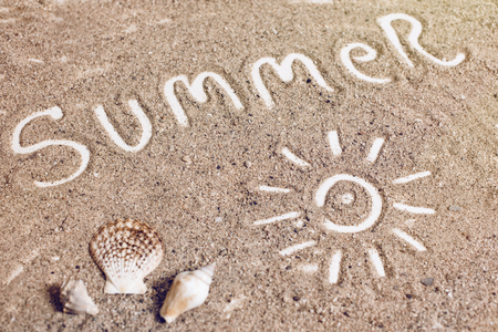 "summer" handwritten on sand, summer backgroundの写真素材