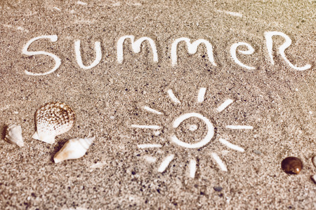"summer" handwritten on sand,の写真素材