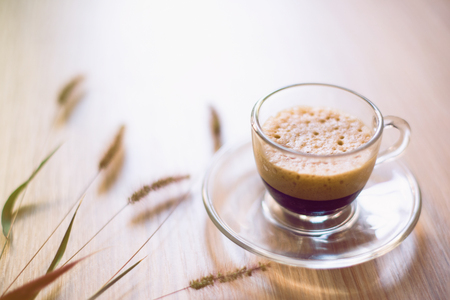 Cup of coffee on wooden backgroundの写真素材